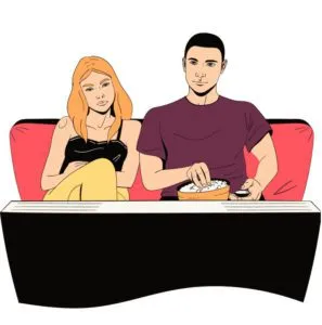Парень и девушка вместе смотрят телевизор