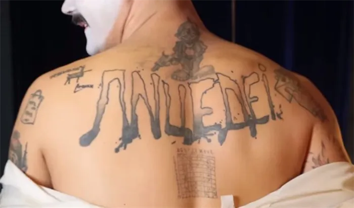 Юрий Музыченко и его татуировка на спине