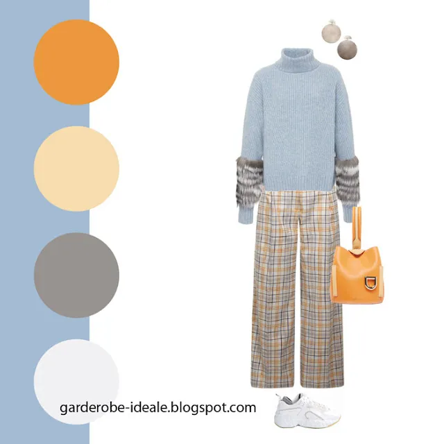 Сочетание голубого свитера и брюк в оранжевую клетку и оранжевой сумки